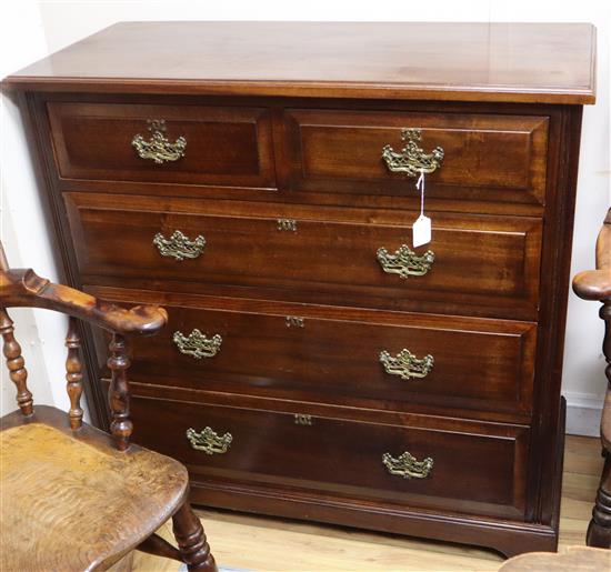 An Edwardian chest of three long and two short drawers with brass handles W.106cm